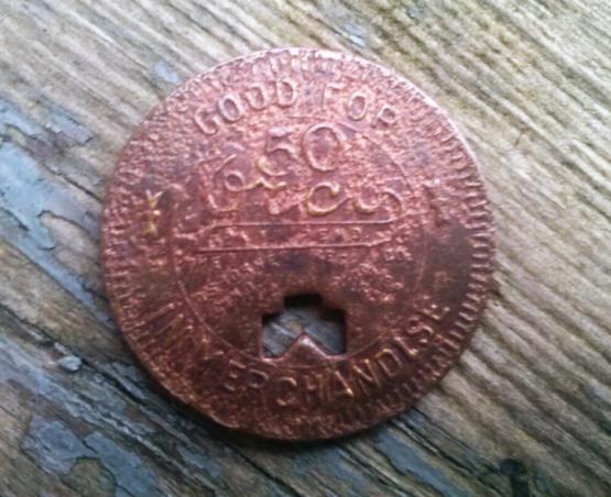 $0.50 company scrip submitted by Carl Smith.  Found metal detecting.