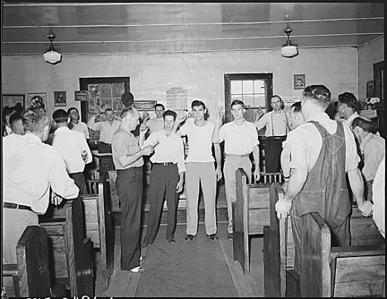 G.W. Hall, district field worker UMWA gives oath to miners joining union. Black Mountain Corporation, 30-31, Kenvir, Harlan County, Kentucky., 09/06/1946.  National Archives Photos of the Medical Survey of the Bituminous Coal Industry, 1946 – 1947 Lee Russell, 1903-1986, Photographer